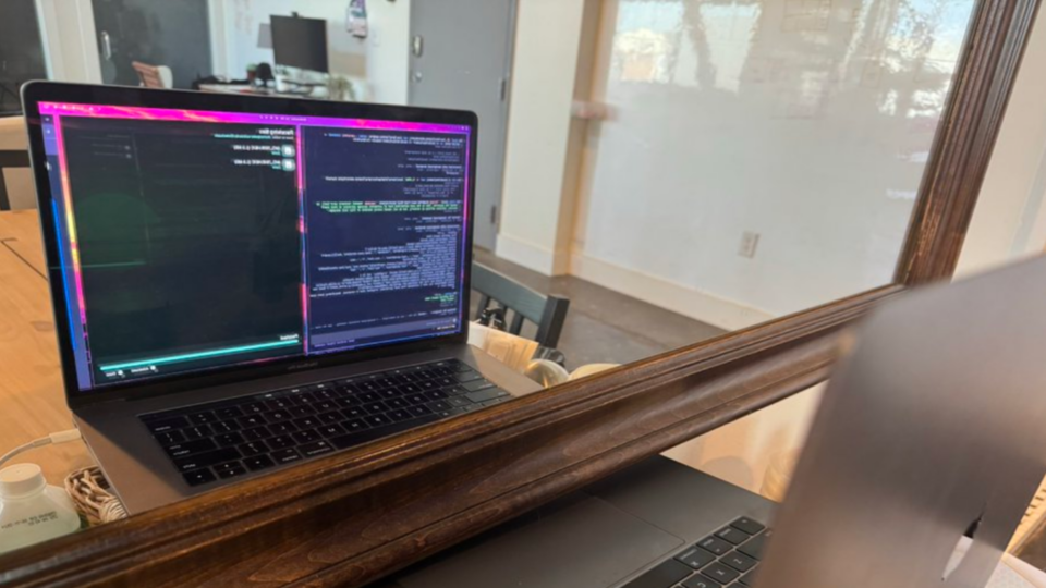 AI agent uses webcam and mirror to inspect Radeon driver changes on an Intel MacBook